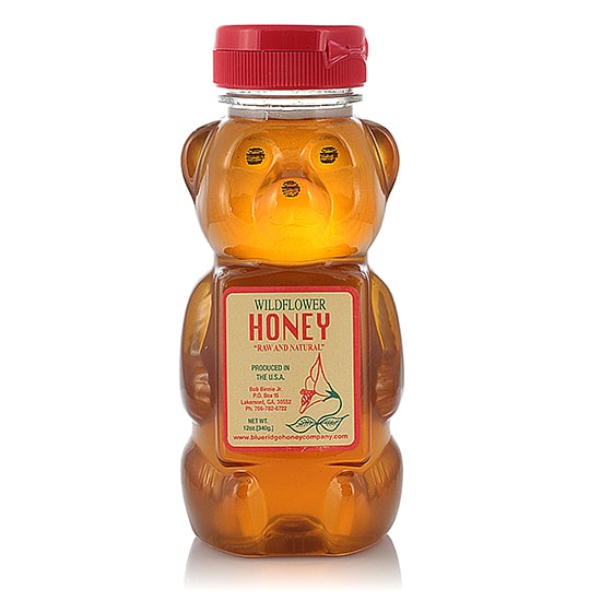 honey in glass bottle photo